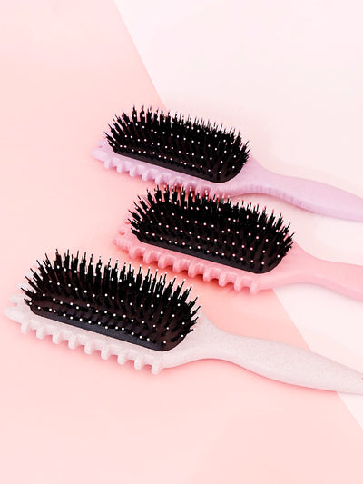 Brosse coiffante pour cheveux bouclés